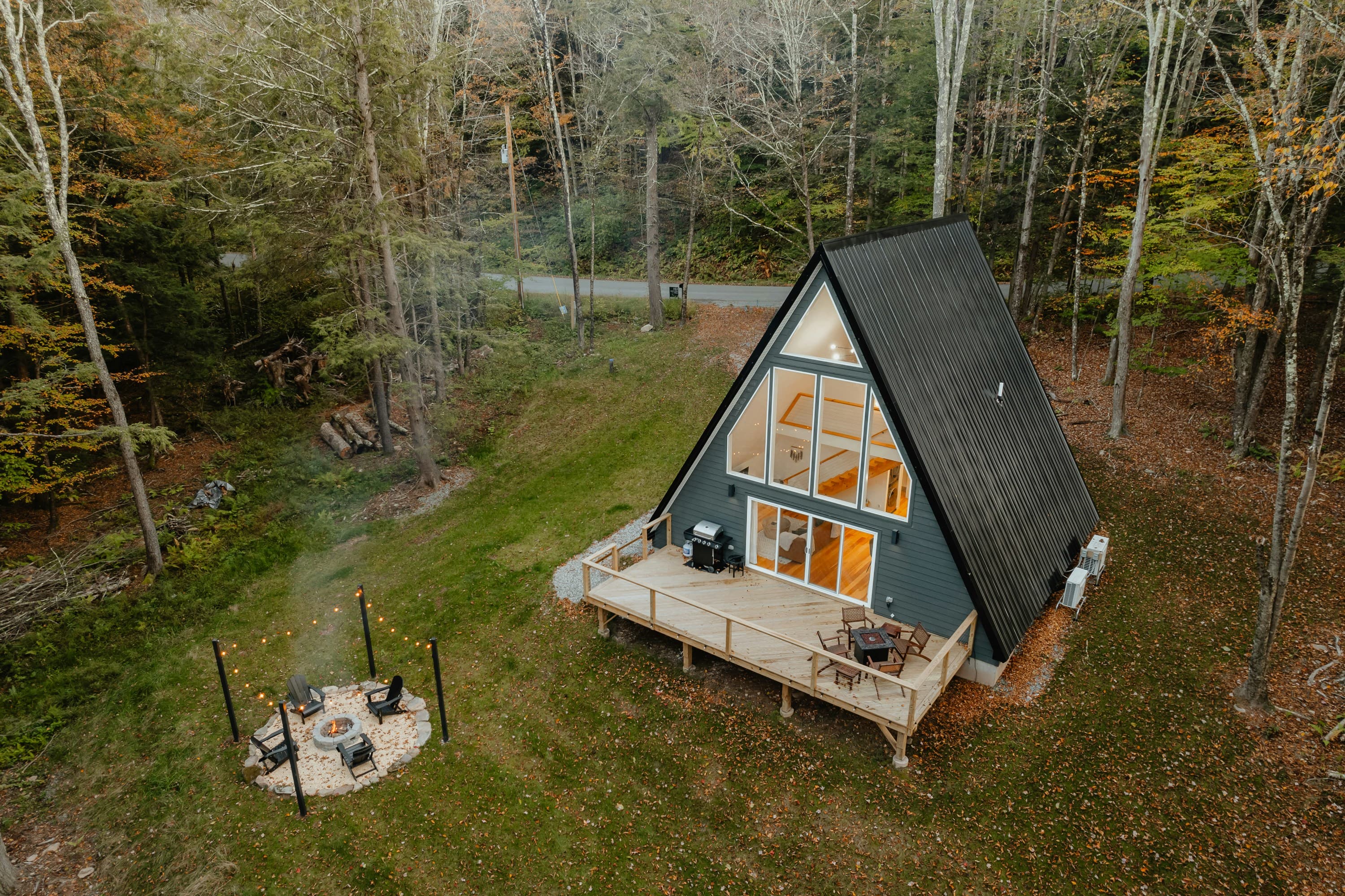 A quiet morning inside the DREAM HOUSE cabin — coffee by the fireplace